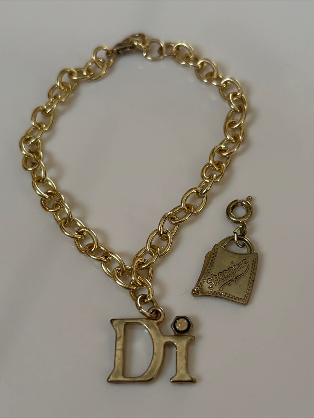 Gold Tone 'Di' Charm Chain Bracelet with Shopping Charm